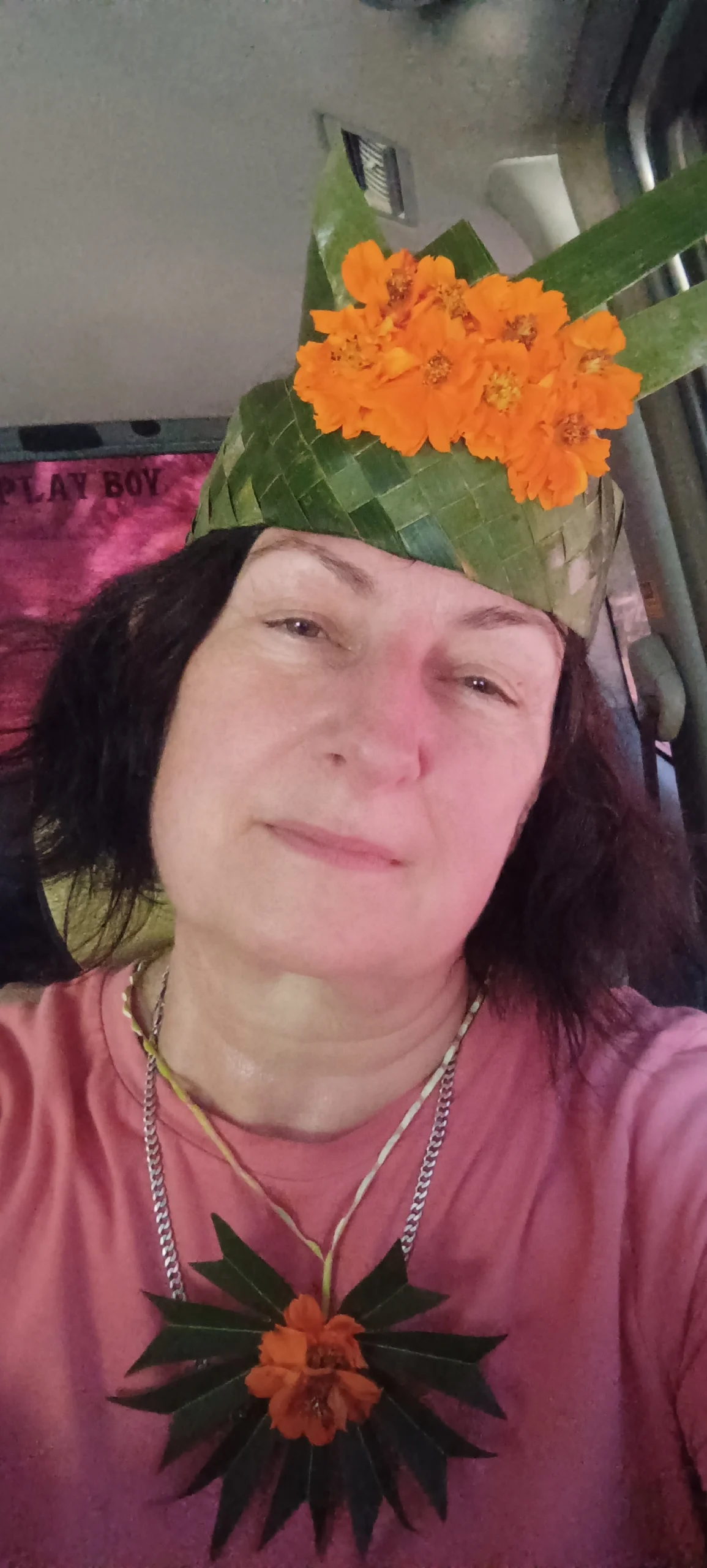 Woman wearing a handwoven flower headpiece made on a Zanzibar spice farm