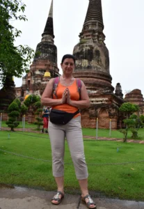 Solo female traveler at Wat Yai Chai Mongkhon in Ayutthaya, Thailand, travel affiliate marketing for beginners